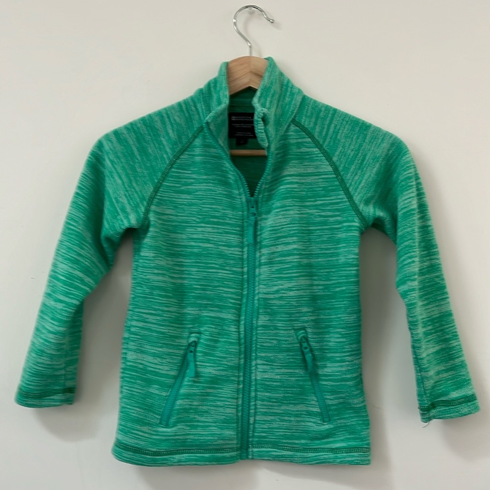 Heather green Mountain Warehouse fleece zip up size 5-6 with two zip pockets.